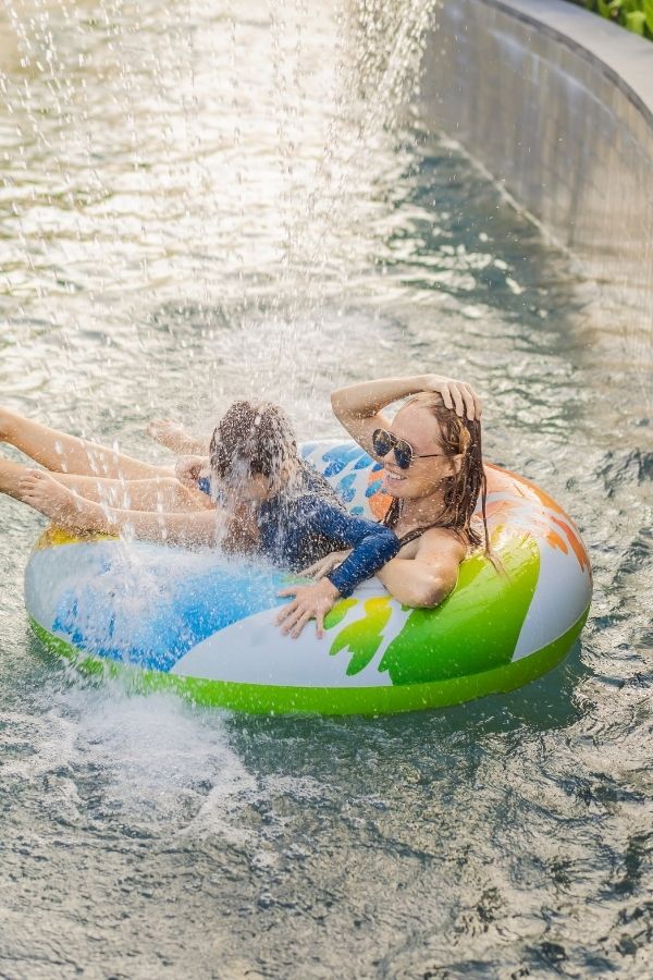 mom and child on a giant water slide family experience