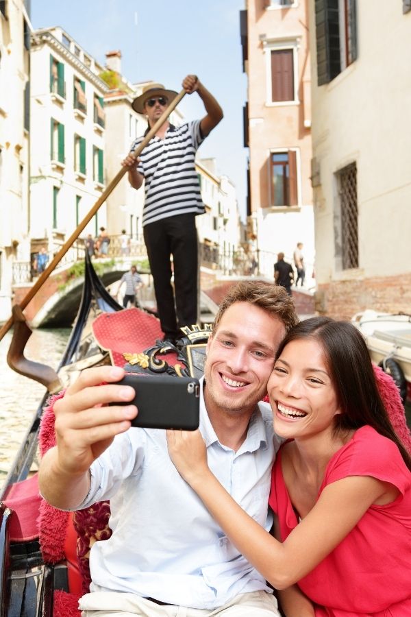 couples bucket list - couple on a gondola ride in Venice Italy